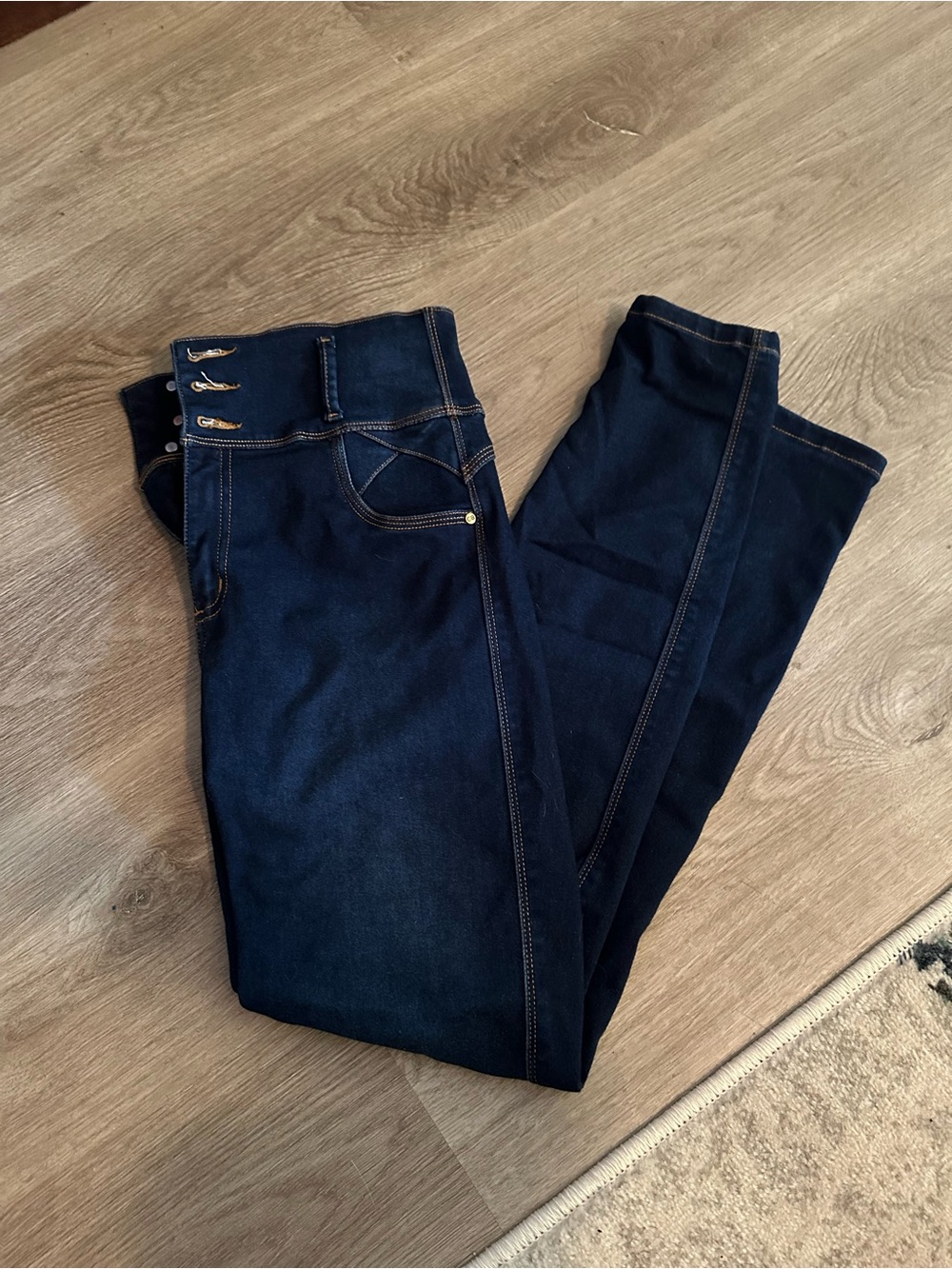 High-Rise Dark Blue Skinny Jeans with Button Detail butt enhancing